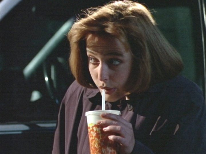 Dana Scully (X-Files) sips a soda through a straw