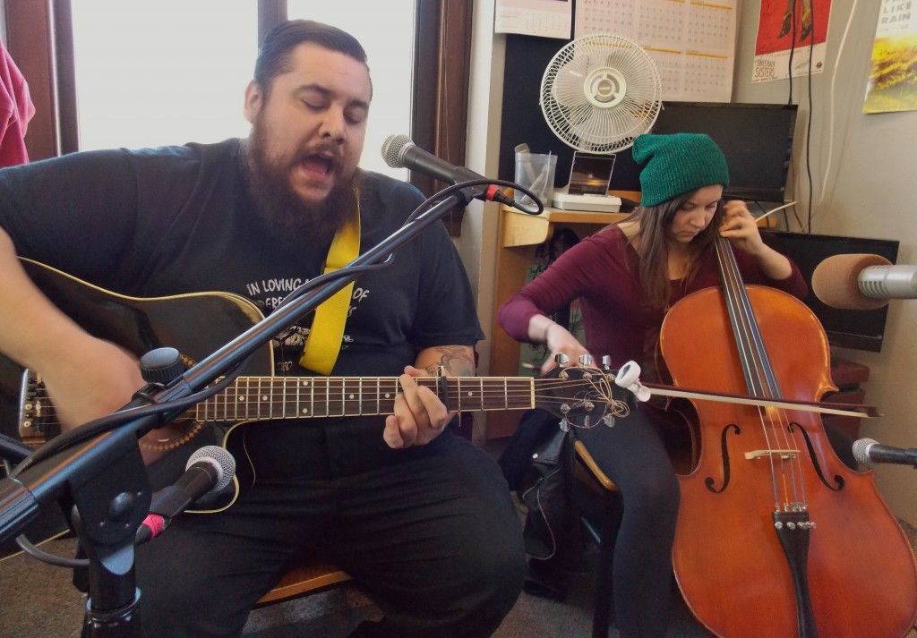 Guitarist and cellist performing live in studio