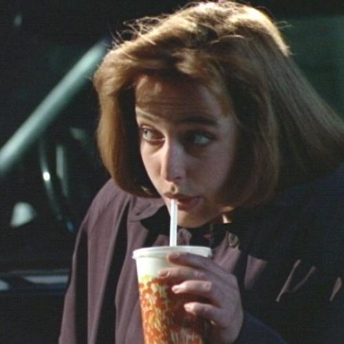 Dana Scully (X-Files) sips a soda through a straw