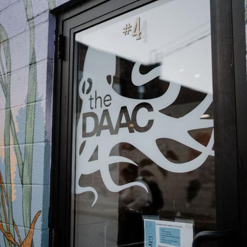 Glare shines on The DAAC's front door, unit #4